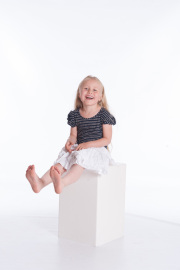Laughing girl photographed in the studio