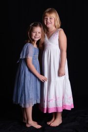 Two beautiful sisters posing for their photograph