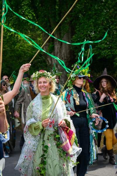 Participants in the 2026 New Forest Green Man Parade walk through the charming village of Burley in Hampshire. This vibrant procession celebrates ancient folklore and the spirit of nature, with attendees adorned in festive greenery and floral crowns, symbolizing the renewal and energy of the woods. The event brings the local community together to honor the timeless traditions of the New Forest. #jerryfennerphotography #newforestphotographer #greenmanparade #burley #hampshirelife #folklorefestival