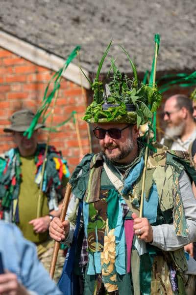 A participant dressed in elaborate, foliage-adorned traditional attire embodies the spirit of the Green Man during the New Forest Green Man Parade 2026 in the picturesque village of Burley, Hampshire. This vibrant community event celebrates local folklore and nature, with strong ties to traditions like those upheld by New Forest Cider.#jerryfennerphotography#newforestphotographer#greenmanparade#burley#hampshire#newforestcider