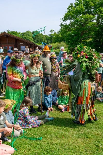 At the vibrant New Forest Green Man Parade 2026, held in the picturesque village of Burley, Hampshire, a crowd of families and enthusiasts gathers to celebrate the spirit of nature. The event features a central Green Man figure adorned in elaborate foliage, representing the rebirth of spring and the woodland spirit of the region. Supported by New Forest Cider, this local tradition brings the community together for a day of folk festivities, floral crowns, and a shared appreciation for the beauty of the New Forest landscape.#jerryfennerphotography #newforestphotographer #greenmanparade #burley #hampshirelife #newforestcider