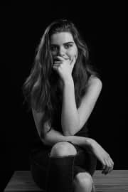 A captivating portrait taken during a session of teenage photographs at The Studio on the Hill. This session was designed to highlight the subject's natural charm and thoughtful expression through professional, minimalist lighting. #jerryfennerphotography #newforestphotographer #portraitphotography #blackandwhitephotography #teenageportrait #studiosession