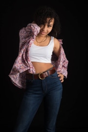 A young woman strikes a confident pose during a session of Teenage photographs at The Studio on the Hill. This portrait aims to capture her unique personality and personal style in a professional studio environment.#jerryfennerphotography#newforestphotographer#teenportrait#studiophotography#portraitphotography#youthstyle