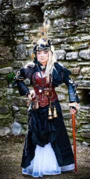 A woman showcases her intricate steampunk attire while posing at the historic Norman House in Christchurch, Dorset. This striking portrait, captured as part of a creative series titled Obsessions, highlights the detailed craftsmanship of her outfit against the atmospheric backdrop of ancient ruins.#jerryfennerphotography#newforestphotographer#steampunkfashion#normanhouse#christchurchdorset#steampunkstyle
